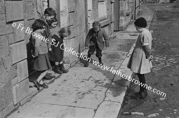 CHILDREN PLAYING IN STREET